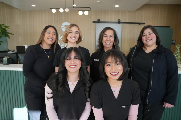 Dental team in professional attire.